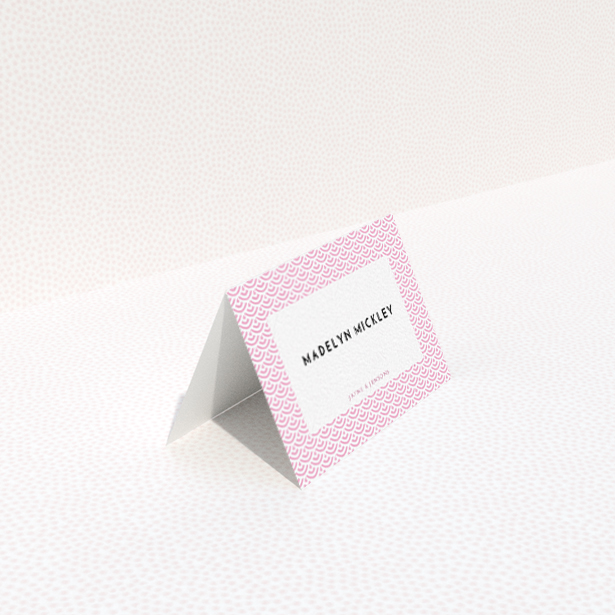 A table place card called "Pink Fans". It is an 85 x 55mm card in a landscape orientation. "Pink Fans" is available as a folded card, with tones of pink and white.