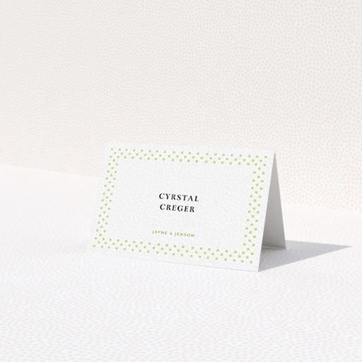 A table place card named 'Polka-dot Splatter'. It is an 85 x 55mm card in a landscape orientation. 'Polka-dot Splatter' is available as a folded card, with tones of gold and white.