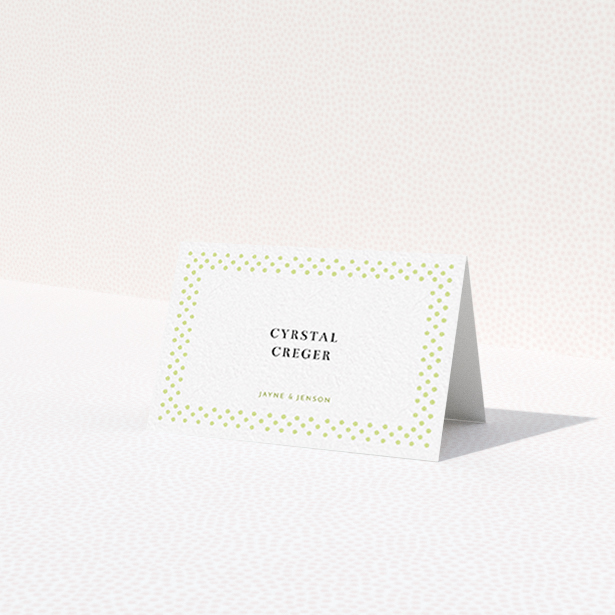 A table place card named "Polka-dot Splatter". It is an 85 x 55mm card in a landscape orientation. "Polka-dot Splatter" is available as a folded card, with tones of gold and white.