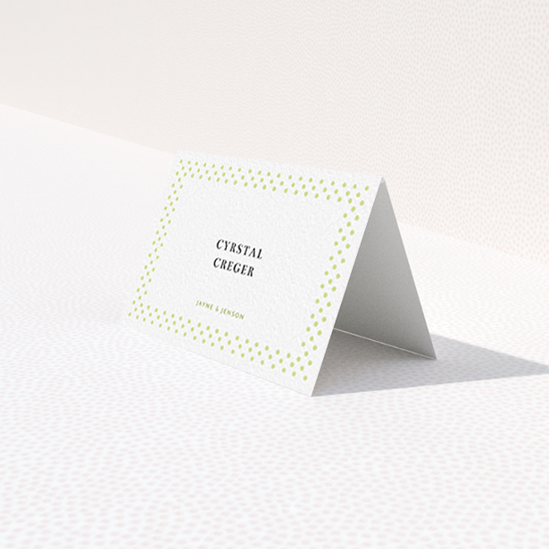 A table place card named "Polka-dot Splatter". It is an 85 x 55mm card in a landscape orientation. "Polka-dot Splatter" is available as a folded card, with tones of gold and white.