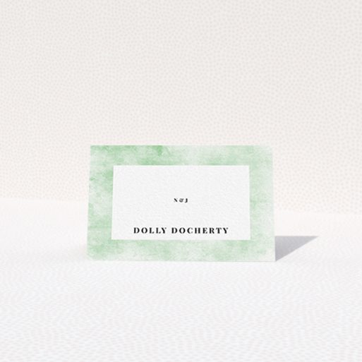 A table place card called "Rustic Green". It is an 85 x 55mm card in a landscape orientation. "Rustic Green" is available as a folded card, with tones of green and white.