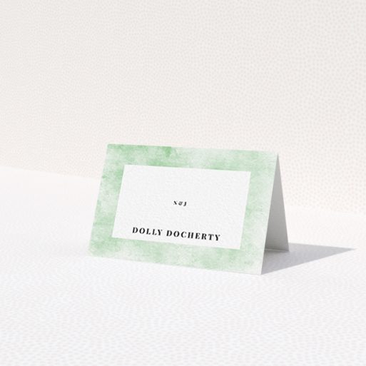 A table place card called 'Rustic Green'. It is an 85 x 55mm card in a landscape orientation. 'Rustic Green' is available as a folded card, with tones of green and white.