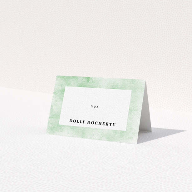 A table place card called "Rustic Green". It is an 85 x 55mm card in a landscape orientation. "Rustic Green" is available as a folded card, with tones of green and white.