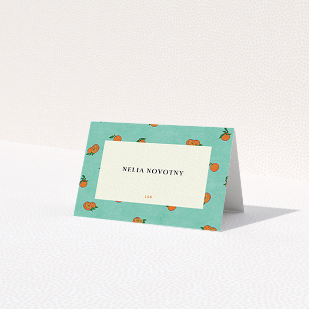 A table place card design called 'Seville'. It is an 85 x 55mm card in a landscape orientation. 'Seville' is available as a folded card, with tones of green and orange.