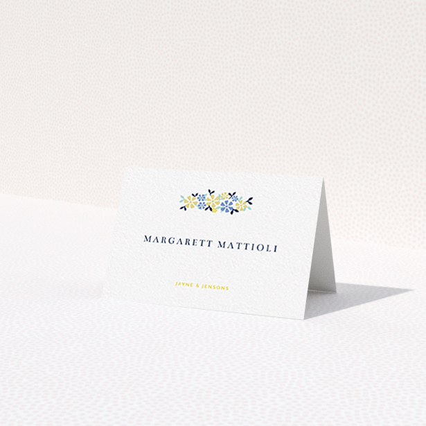 A table place card template titled 'Simplistic Bouquet'. It is an 85 x 55mm card in a landscape orientation. 'Simplistic Bouquet' is available as a folded card, with tones of white and blue.