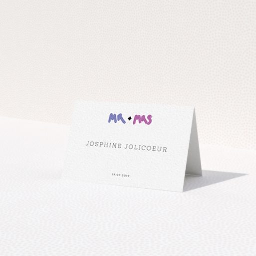 A table place card design named 'The New Mr and Mrs'. It is an 85 x 55mm card in a landscape orientation. 'The New Mr and Mrs' is available as a folded card, with tones of white and blue.