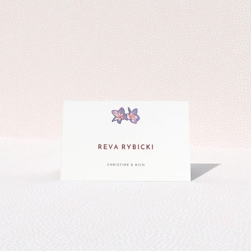Table Place Card Design - "Two little Orchids" A table place card template titled "Two little Orchids". It is an 85 x 55mm card in a landscape orientation. "Two little Orchids" is available as a folded card, with tones of white and purple.