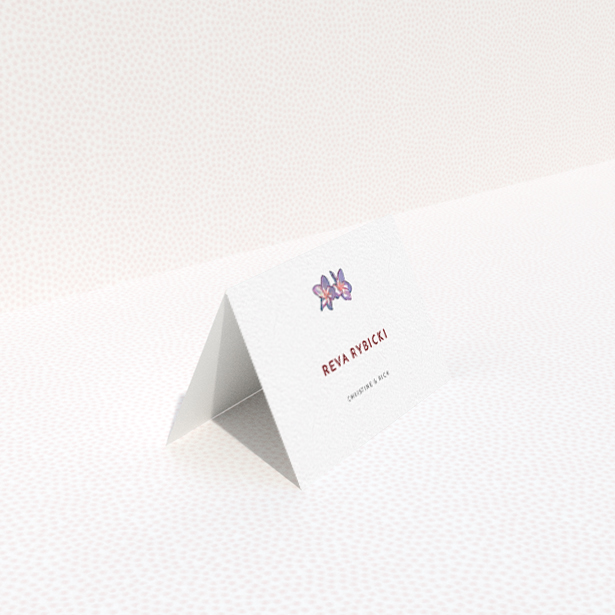 A table place card template titled "Two little Orchids". It is an 85 x 55mm card in a landscape orientation. "Two little Orchids" is available as a folded card, with tones of white and purple.