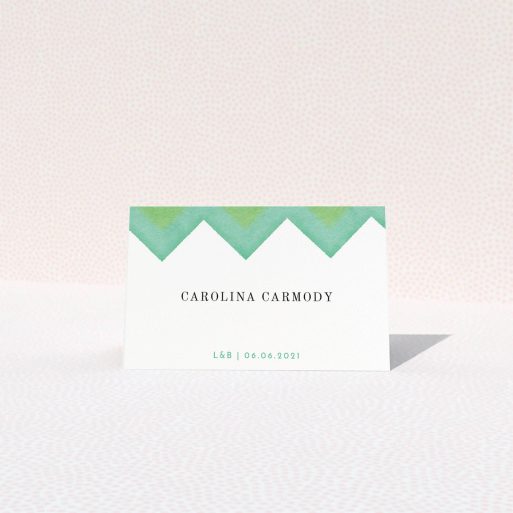 Table Place Card Design - "Vibrant Peaks" A table place card named "Vibrant Peaks". It is an 85 x 55mm card in a landscape orientation. "Vibrant Peaks" is available as a folded card, with tones of green and white.