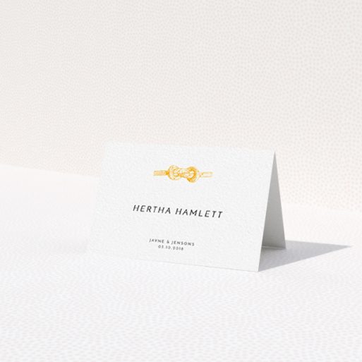 A table place card design named 'We Tied the Knot'. It is an 85 x 55mm card in a landscape orientation. 'We Tied the Knot' is available as a folded card, with tones of white and orange.