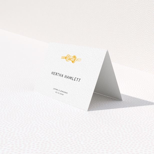A table place card design named "We Tied the Knot". It is an 85 x 55mm card in a landscape orientation. "We Tied the Knot" is available as a folded card, with tones of white and orange.