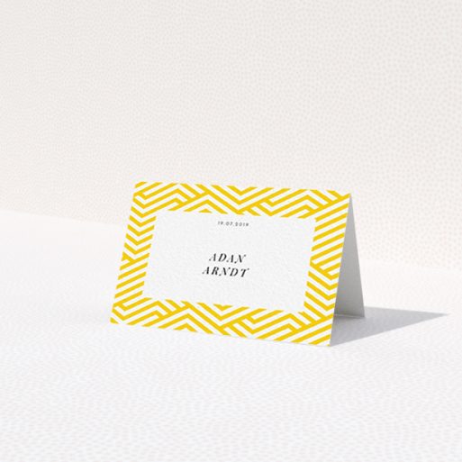 A table place card named 'Yellow lines'. It is an 85 x 55mm card in a landscape orientation. 'Yellow lines' is available as a folded card, with tones of yellow and white.