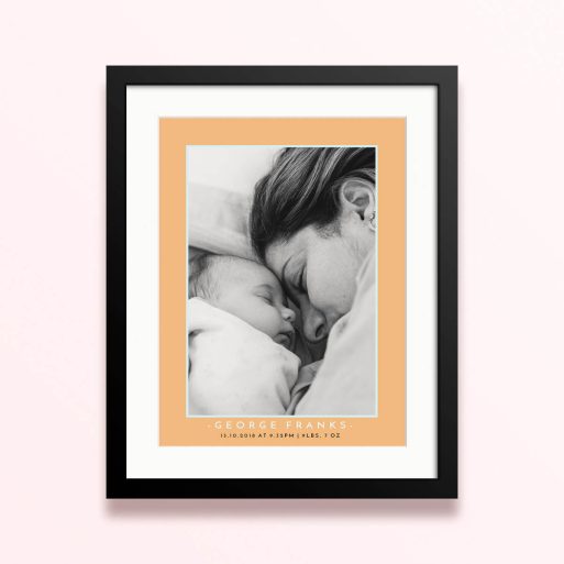 Framed and mounted photo print with a single black and white image of a mother and baby.