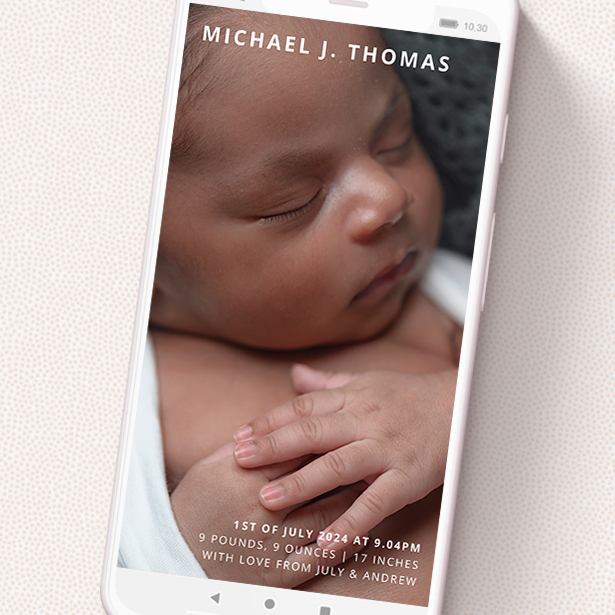 A text message birth announcement design named 'Sans Serif'. It is a smartphone screen sized announcement in a portrait orientation. It is a photographic text message birth announcement with room for 1 photo. 'Sans Serif' is available as a flat announcement, with mainly white colouring.