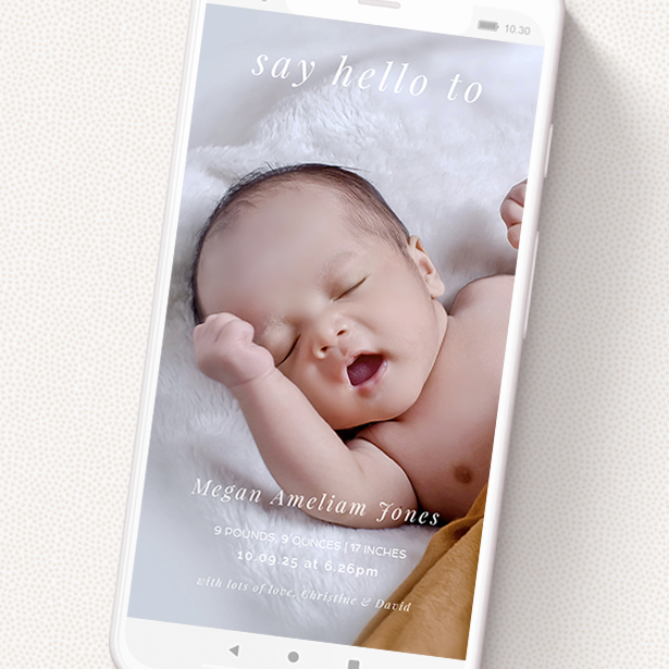 A text message birth announcement design titled 'Thin White Border'. It is a smartphone screen sized announcement in a portrait orientation. It is a photographic text message birth announcement with room for 1 photo. 'Thin White Border' is available as a flat announcement, with mainly white colouring.