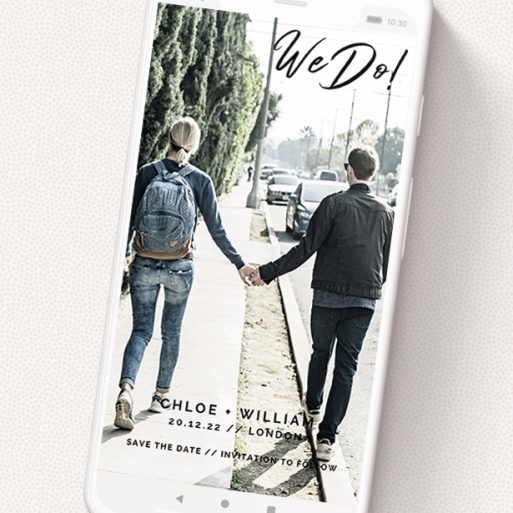 A text message save the date design named 'We Do'. It is a smartphone screen sized save the date in a portrait orientation. It is a photographic text message save the date with room for 1 photo. 'We Do' is available as a flat save the date, with mainly black colouring.