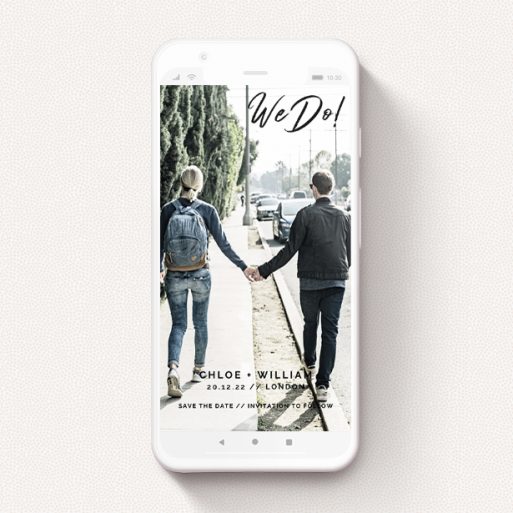 A text message save the date design named "We Do". It is a smartphone screen sized save the date in a portrait orientation. It is a photographic text message save the date with room for 1 photo. "We Do" is available as a flat save the date, with mainly black colouring.