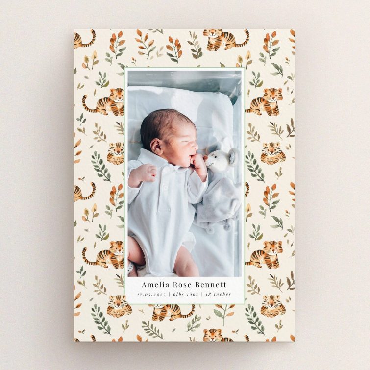 Birth announcement card featuring floral and tiger design with one baby photo.