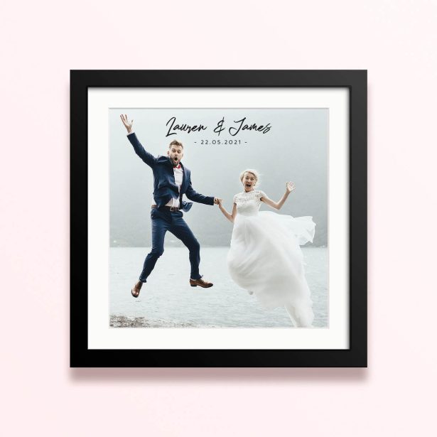 Framed and mounted photo print featuring one photo of a joyful couple on their wedding day.