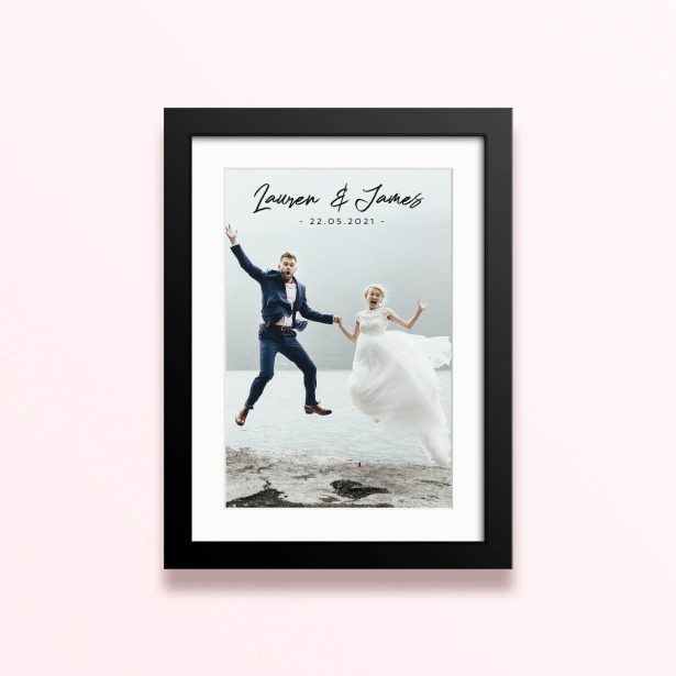 Framed and mounted photo print featuring one photo of a joyful couple on their wedding day.
