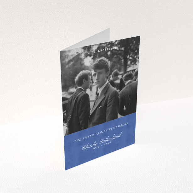 Funeral thank you card with black and white photo of a person in formal attire.