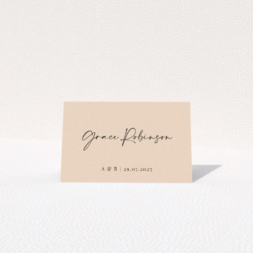 Top Date place cards table template - bold sans-serif fonts for the date and elegant flowing script for couple's names on warm neutral backdrop for chic simplicity. This is a view of the front