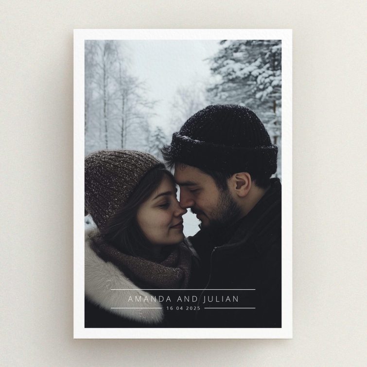 Elegant winter-themed engagement party invitations featuring a cosy couple in snow-covered scenery.