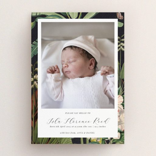 Birth announcement card design featuring a photo of a newborn baby with floral border.