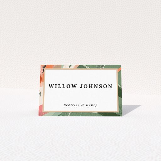 Tropical foliage place cards with vibrant exotic leaves in green, peach, and pink, ideal for wedding stationery suites inspired by lush paradises This is a view of the front