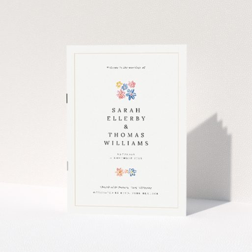 "Paris Floral A5 Wedding Order of Service booklet featuring delicate floral icons in blush pink, sky blue, buttery yellow, and soft coral on a cream background.". This is a view of the front