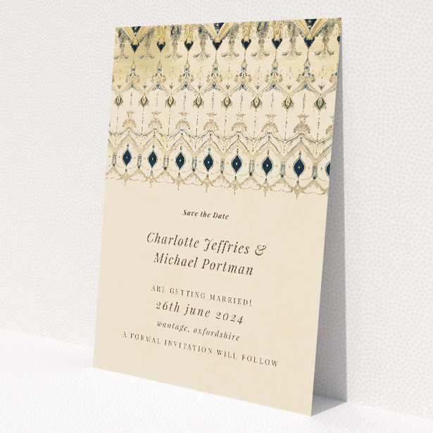 Tapestry wedding save the date card featuring intricate art deco-inspired pattern border in gold, cream, and navy, against warm aged parchment background, evoking sophistication and heritage for a grand yet tastefully understated celebration This is a view of the front