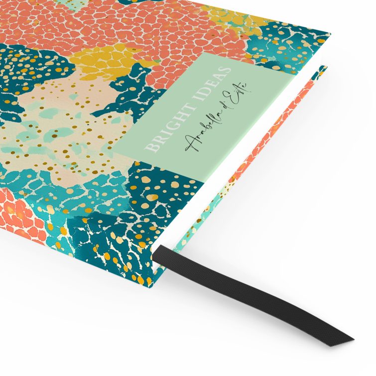 Colourful abstract notebook cover design with vibrant patterns, ideal for personalised stationery.