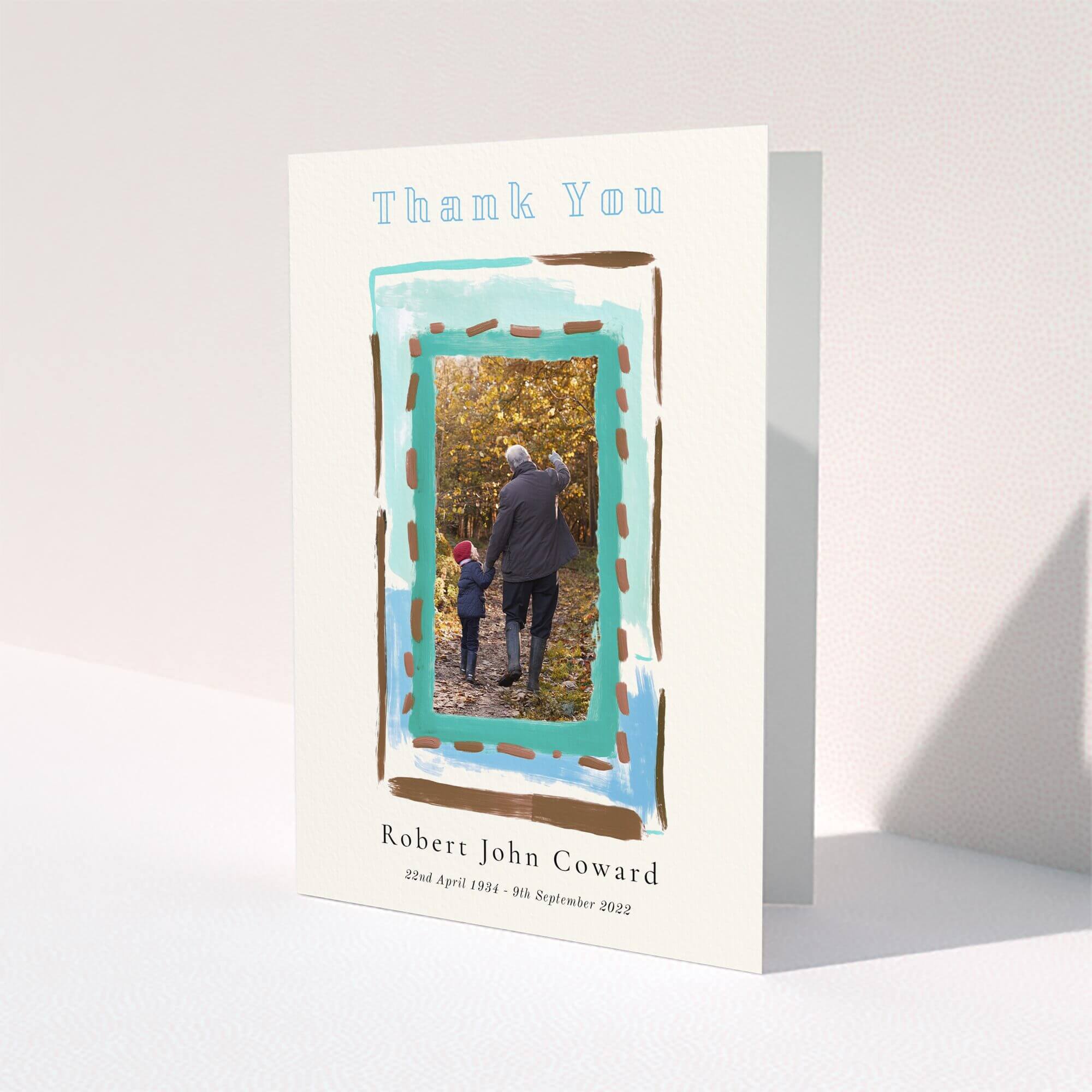 Funeral thank you card design with one photo in a painted frame on a light background