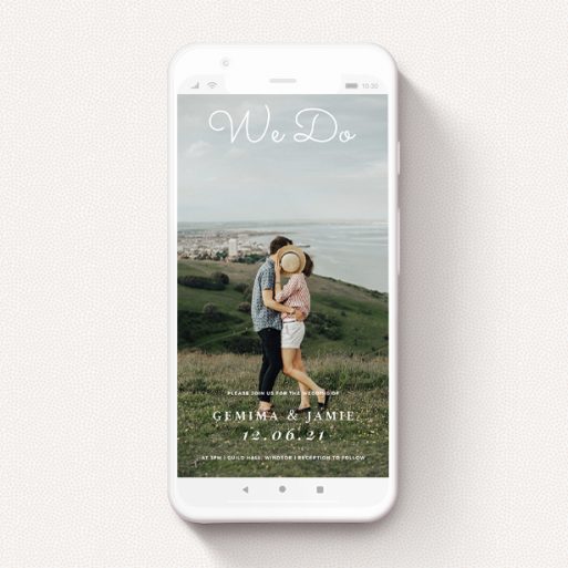 A wedding invitation for whatsapp called "Brighton Pier". It is a smartphone screen sized invite in a portrait orientation. It is a photographic wedding invitation for whatsapp with room for 1 photo. "Brighton Pier" is available as a flat invite, with mainly white colouring.