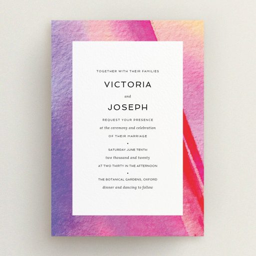 A wedding invite card design called "Abstract Pink Watercolour". It is an A5 invite in a portrait orientation. "Abstract Pink Watercolour" is available as a flat invite, with tones of vibrant pink, purple and red.