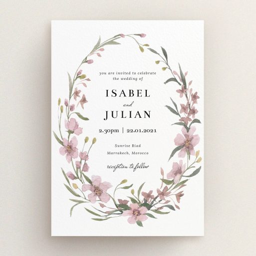 A wedding invite card design named "Autumn Floral Wreath". It is an A5 invite in a portrait orientation. "Autumn Floral Wreath" is available as a flat invite, with tones of faded pink and autumnal green.