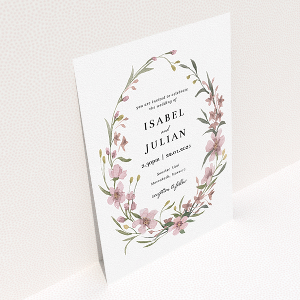 A wedding invite card design named "Autumn Floral Wreath". It is an A5 invite in a portrait orientation. "Autumn Floral Wreath" is available as a flat invite, with tones of faded pink and autumnal green.