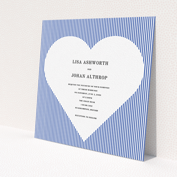 A wedding invite card design titled "Between the Lines". It is a square (148mm x 148mm) invite in a square orientation. "Between the Lines" is available as a flat invite, with tones of blue and white.