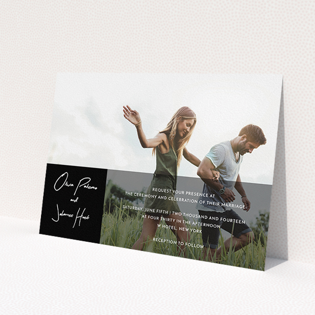A wedding invite card called 'Black on black'. It is an A5 invite in a landscape orientation. It is a photographic wedding invite card with room for 1 photo. 'Black on black' is available as a flat invite, with mainly black colouring.