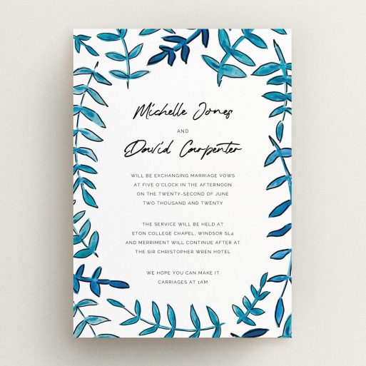 A wedding invite card design titled "Blue Branch Swirl". It is an A5 invite in a portrait orientation. "Blue Branch Swirl" is available as a flat invite, with tones of blue and white.