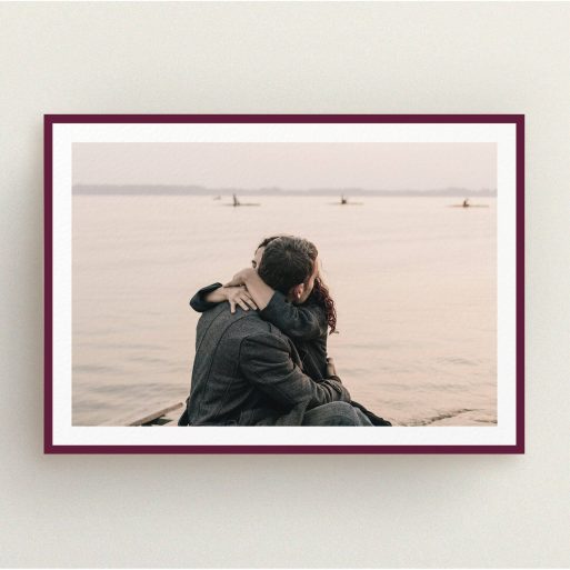 A wedding invite card design titled "Classic Burgundy Photo Frame". It is an A5 invite in a landscape orientation. It is a photographic wedding invite card with room for 1 photo. "Classic Burgundy Photo Frame" is available as a flat invite, with tones of burgundy and white.