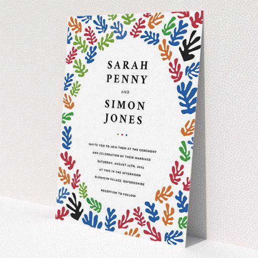 A wedding invite card called 'Cut Out-esque'. It is an A5 invite in a portrait orientation. 'Cut Out-esque' is available as a flat invite, with tones of blue, red and green.