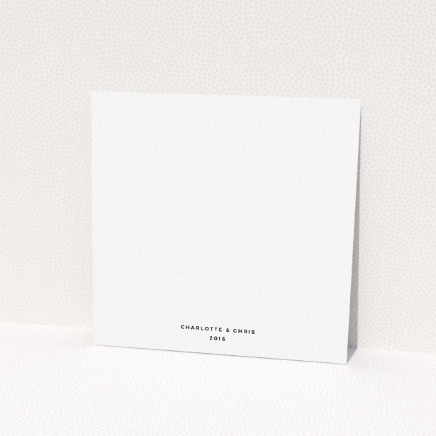 A wedding invite card named "In the suburbs". It is a square (148mm x 148mm) invite in a square orientation. It is a photographic wedding invite card with room for 1 photo. "In the suburbs" is available as a flat invite, with mainly white colouring.