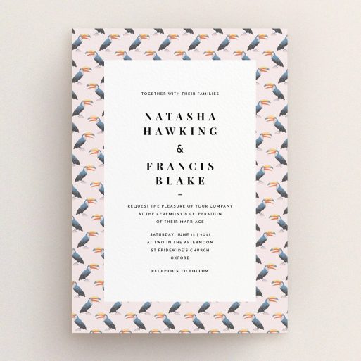 A wedding invite card design named "Lots of Toucans". It is an A5 invite in a portrait orientation. "Lots of Toucans" is available as a flat invite, with tones of pink, blue and orange.