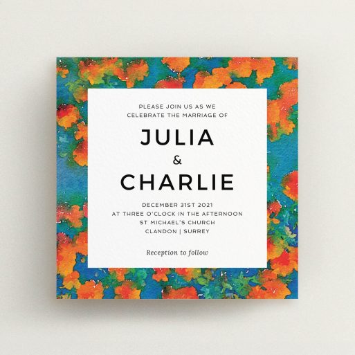 A wedding invite card called "Orange Bloom". It is a square (148mm x 148mm) invite in a square orientation. "Orange Bloom" is available as a flat invite, with tones of orange, blue and green.