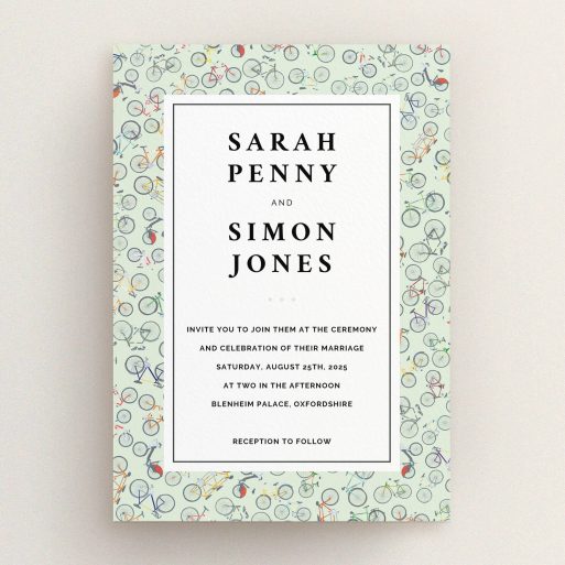 A wedding invite card named "Peloton". It is an A5 invite in a portrait orientation. "Peloton" is available as a flat invite, with tones of green, red and grey.