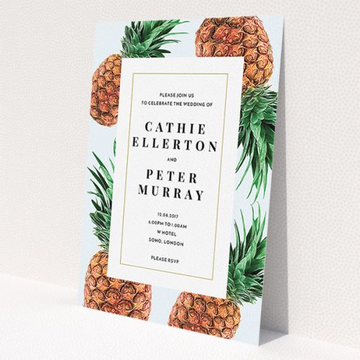 A wedding invite card design named 'Pineapples falling'. It is an A5 invite in a portrait orientation. 'Pineapples falling' is available as a flat invite, with tones of light blue and green.