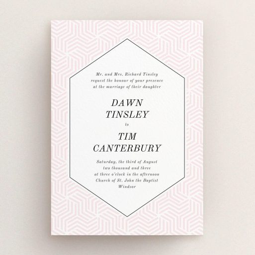 A wedding invite card called "Pink geometric maze". It is an A5 invite in a portrait orientation. "Pink geometric maze" is available as a flat invite, with tones of pink and white.