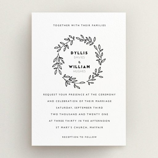 A wedding invite card called "Simple Wreath". It is an A5 invite in a portrait orientation. "Simple Wreath" is available as a flat invite, with tones of white and black.