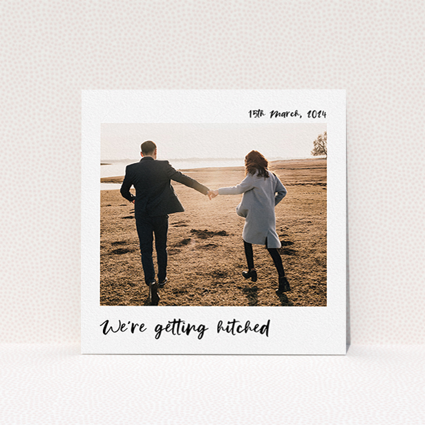 A wedding invite card design called "Top and Bottom Photo". It is a square (148mm x 148mm) invite in a square orientation. It is a photographic wedding invite card with room for 1 photo. "Top and Bottom Photo" is available as a flat invite, with mainly white colouring.